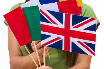 Student female holding international flags. Support or language school concept.